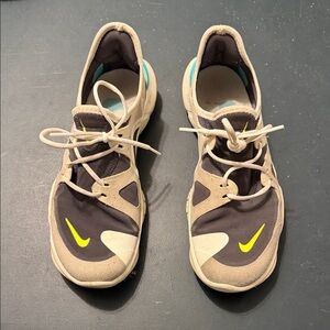 Nike Gray and Black Sneakers with Yellow Swoosh